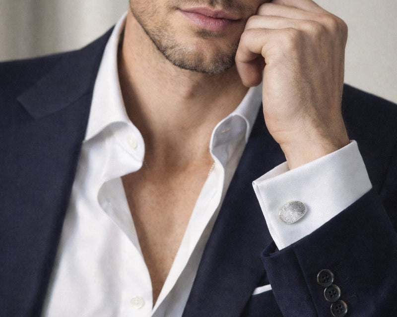 Fingerprint oval cufflinks on a man