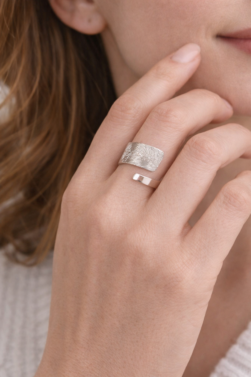 Fingerprint chunky silver ring on woman
