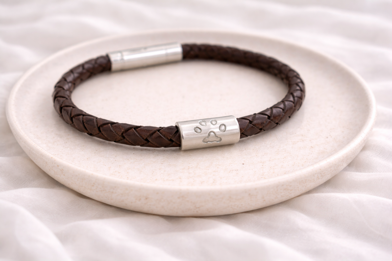 Pawprint charm on a leather bracelet
