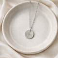 Fingerprint on a sterling silver circular pendant