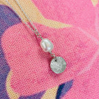 fingerprint circle pendant with a pearl