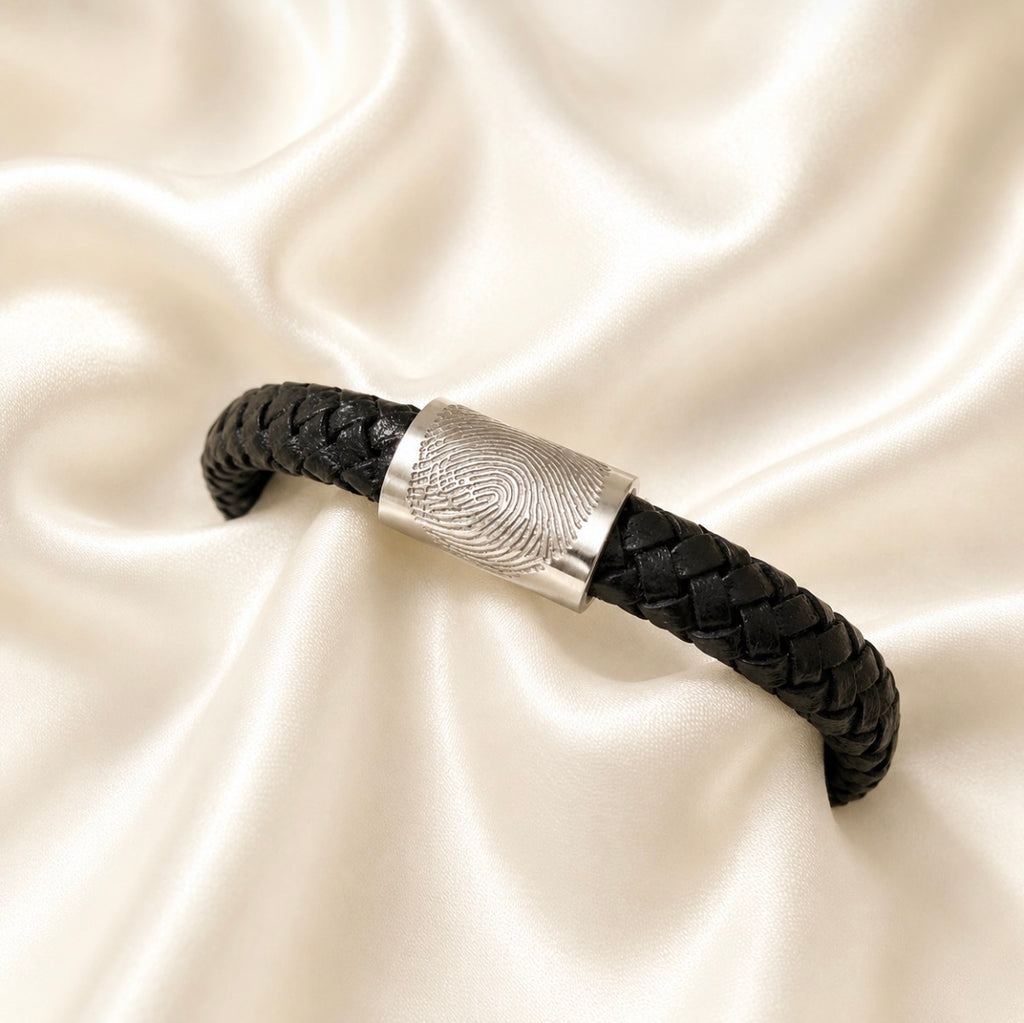 Fingerprint on a thick black leather braided bracelet
