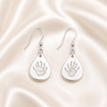 Handprints on silver teardrop drop down earrings