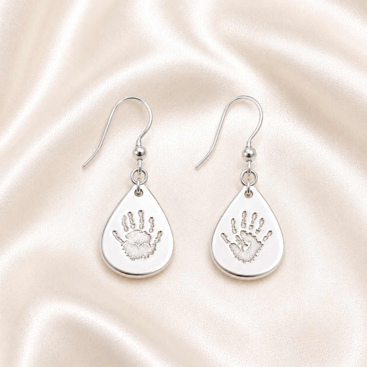 Handprints on silver teardrop drop down earrings