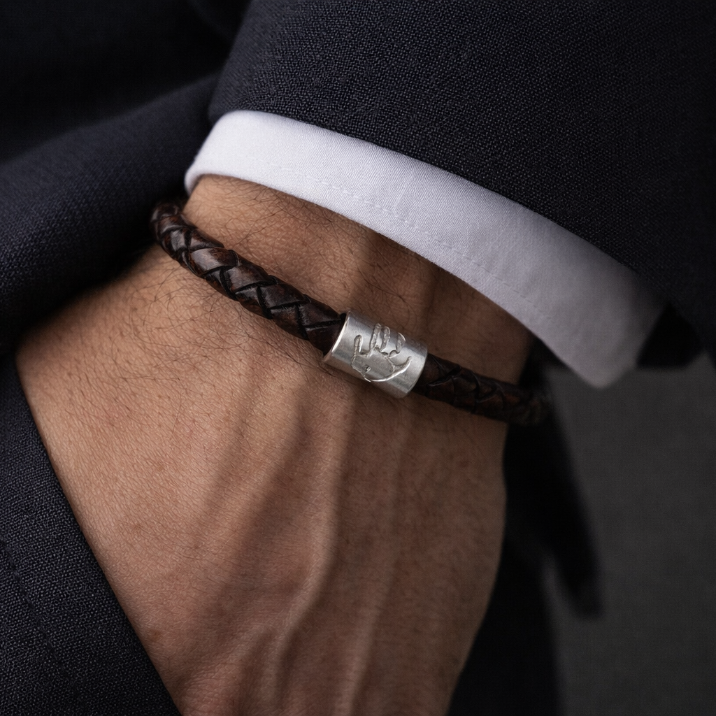 man wearing handprint leather bracelet
