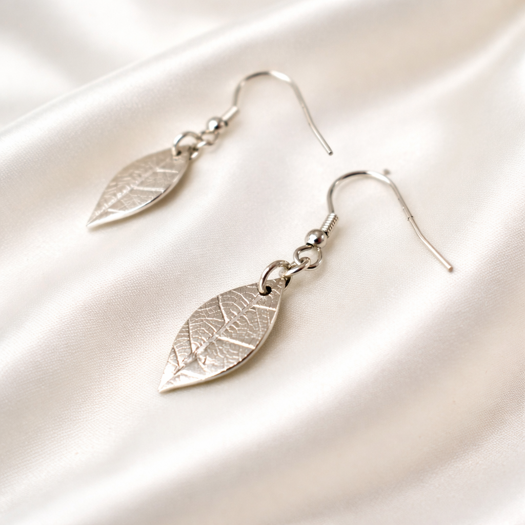 Silver jewellery set of real leaf imprint on a pendant and earrings