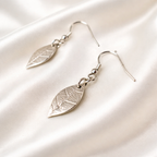 Silver jewellery set of real leaf imprint on a pendant and earrings