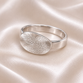 dog noseprint on a silver oval ring