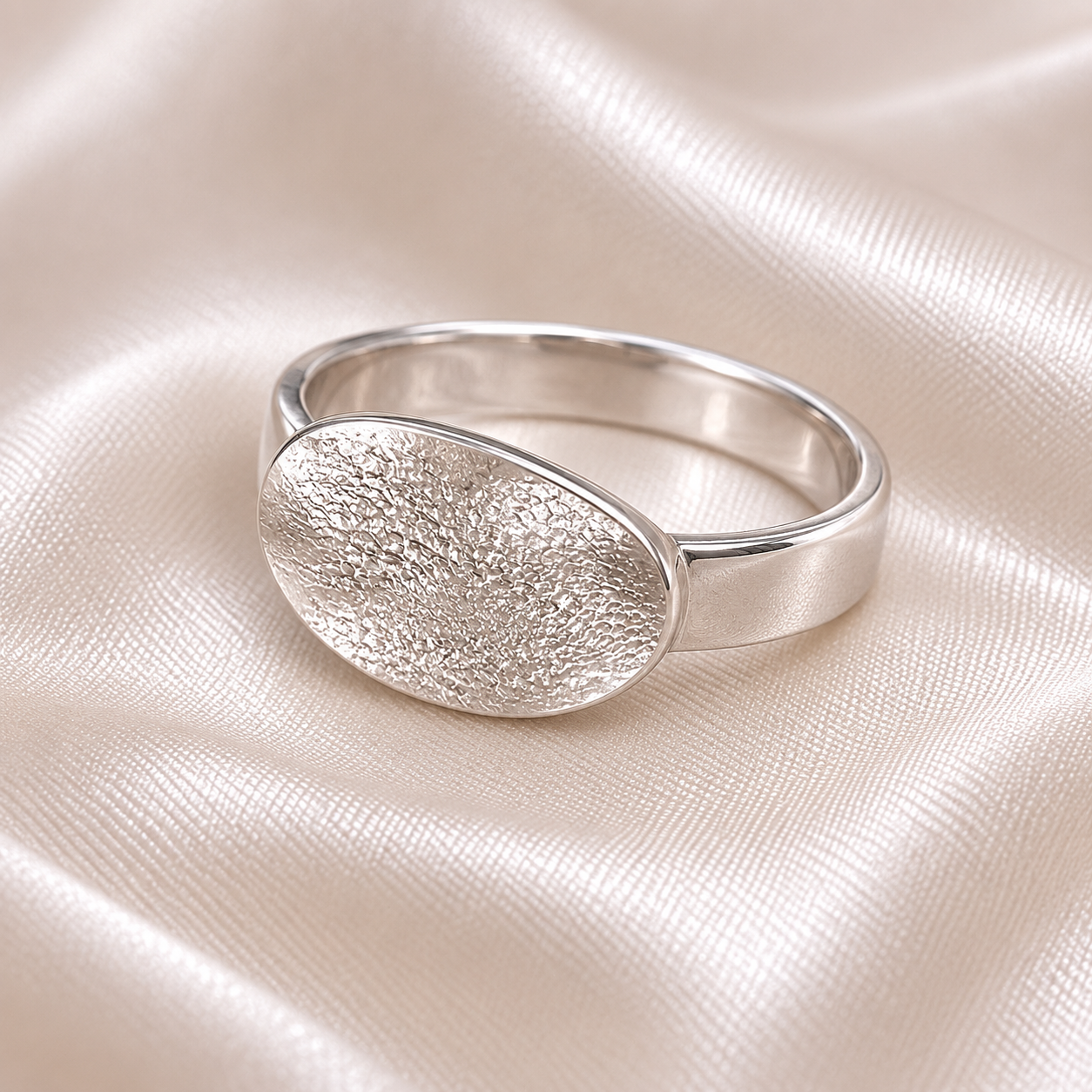 dog noseprint on a silver oval ring