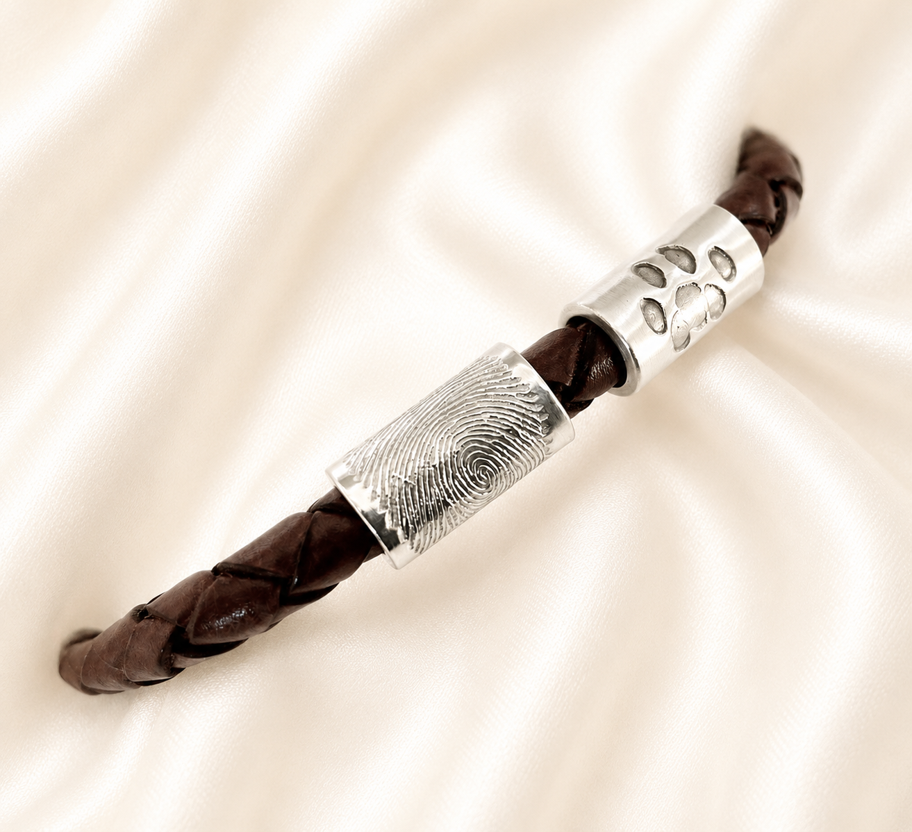 fingerprint charm and pawprnt charm on leather bracelet