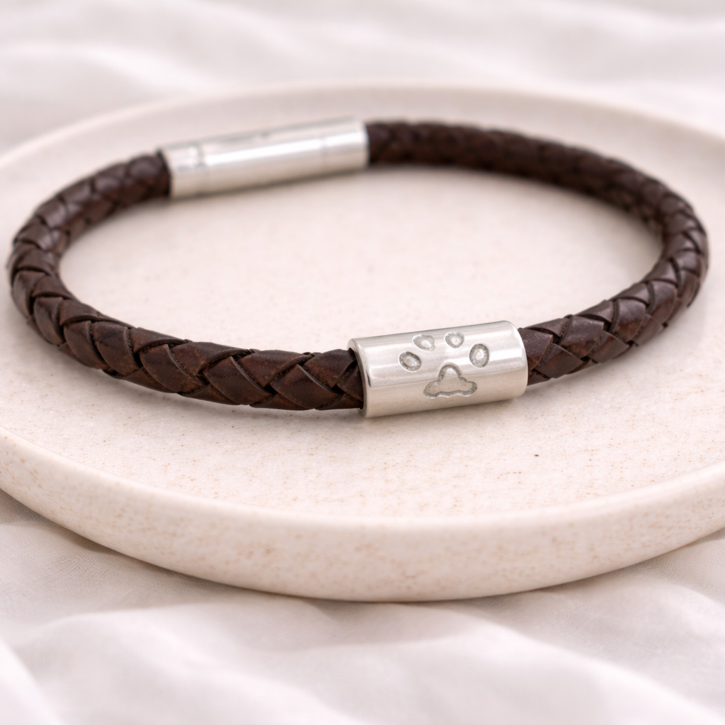 pawprint on a leather bracelet