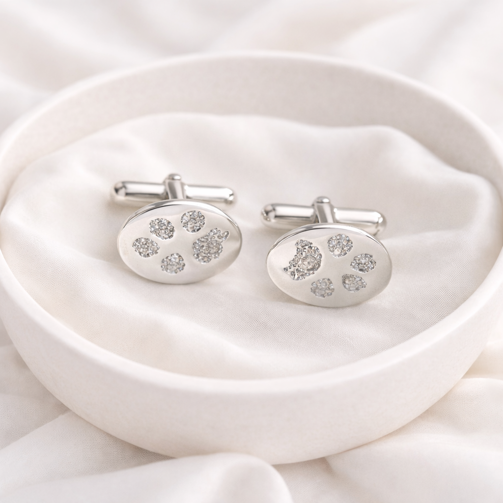 silver cufflinks with pawprints on them