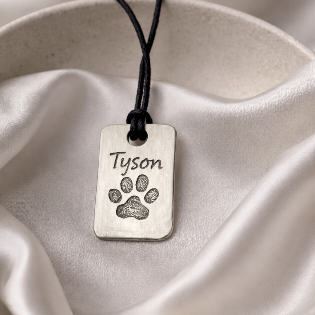 Pawprint on a silver dog tag necklace