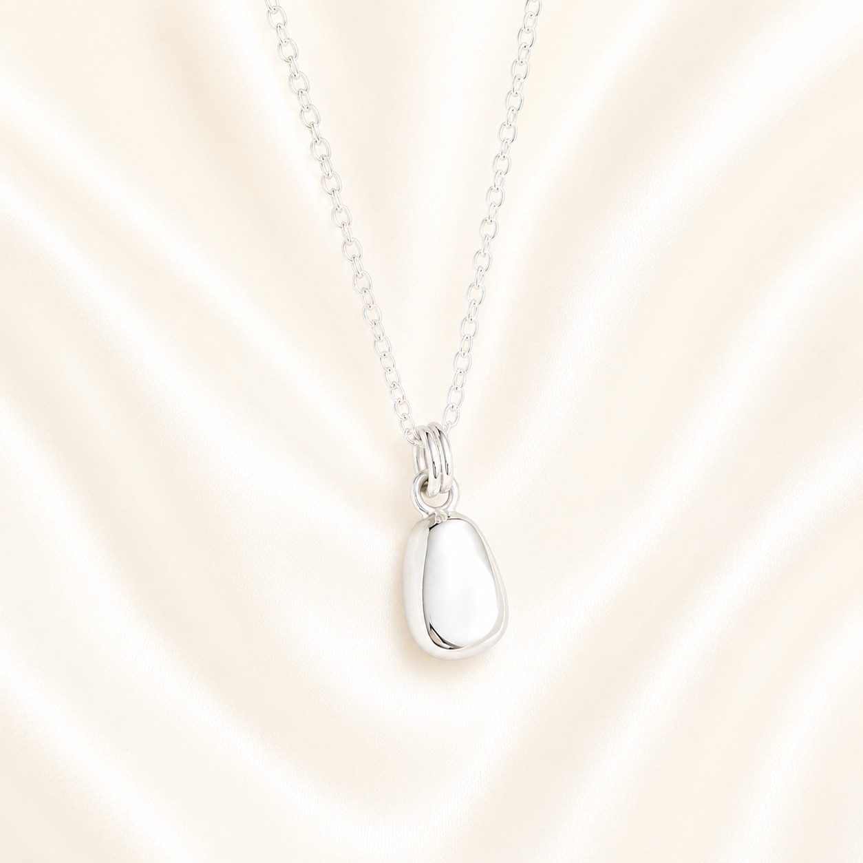 Silver hidden ashes memorial necklace pebble shape