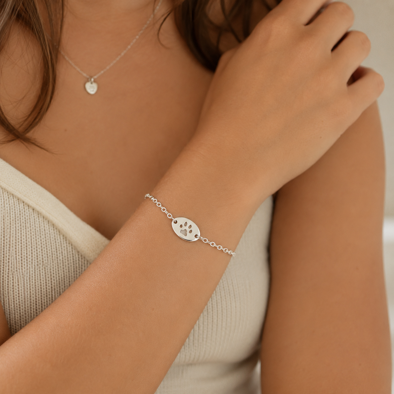Personalised oval charm bracelet with pawprint on it