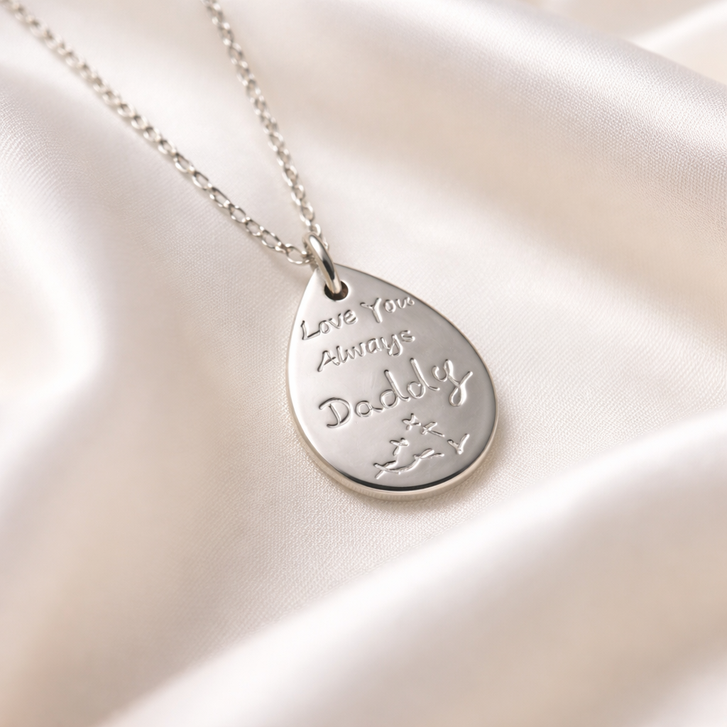 Writing on a teardrop pendant