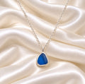 blue sealglass encased in sterling silver necklace