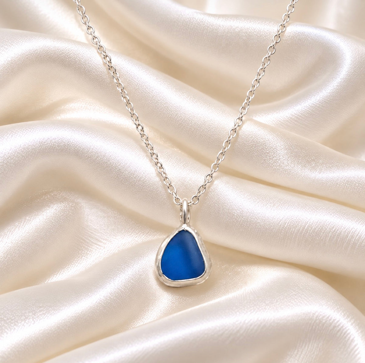 blue sealglass encased in sterling silver necklace