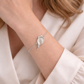 Fingerprint on a bird charm bracelet