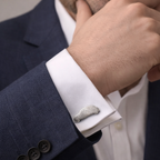 Man wearing car shaped cufflinks with fingerprint on it