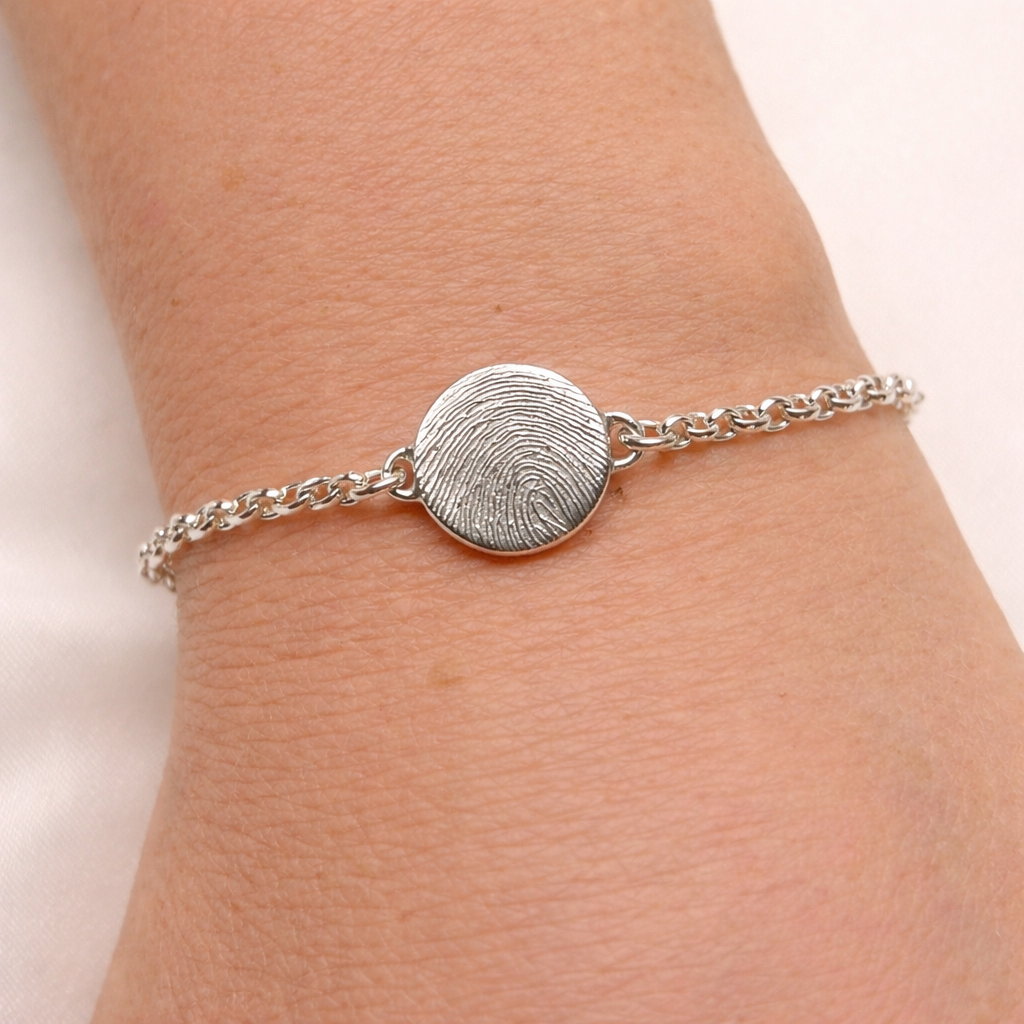 circle charm bracelet with fingerprint on it. personalised bracelet