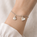 fingerprint heart charms on a bracelet