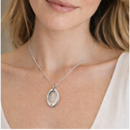 woman wearing oval fingerprint necklace