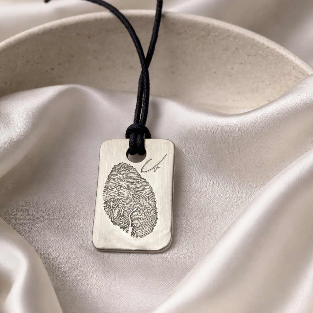 Fingerprint on a silver dog tag