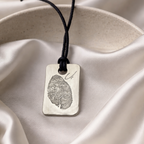 Fingerprint on a silver dog tag