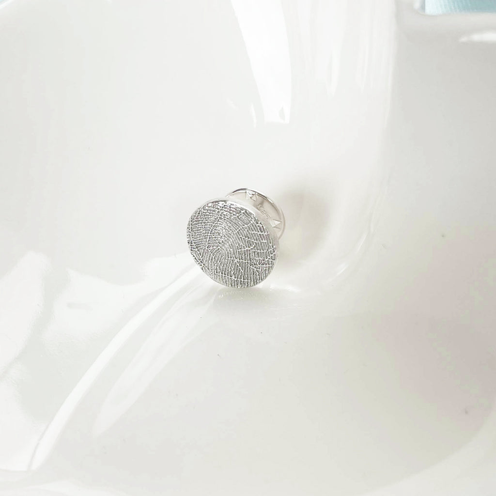 fingerprint on a sterling silver pin