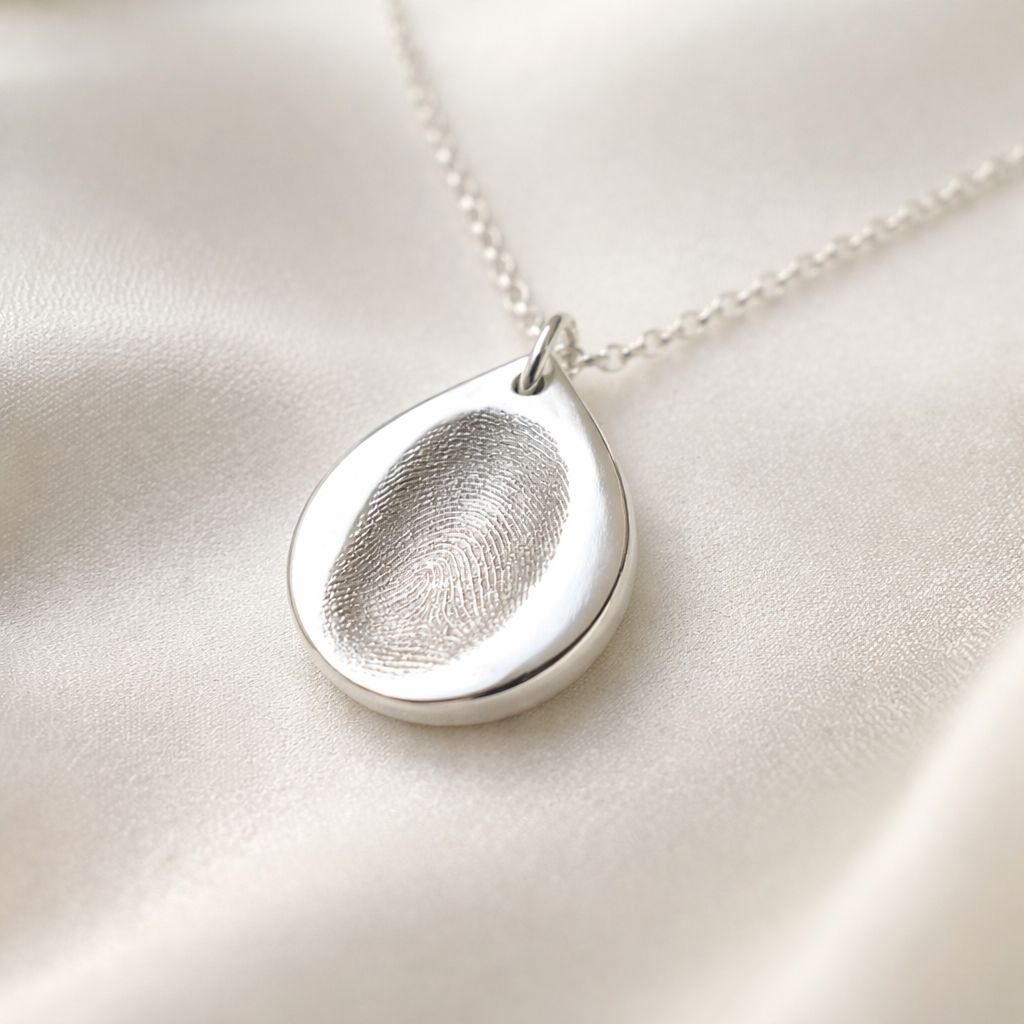fingerprint on a teardrop shape pendant