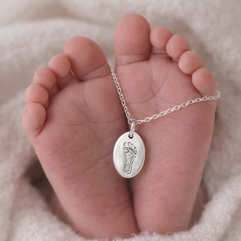 footprint on an oval necklace