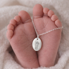 footprint on an oval necklace