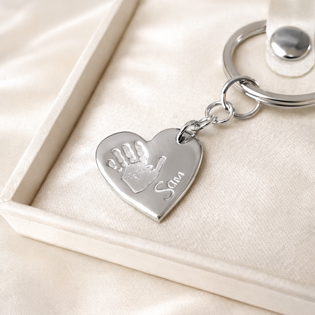 heart keyring with handprint on it