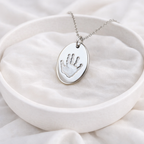 child handprint on a oval pendant
