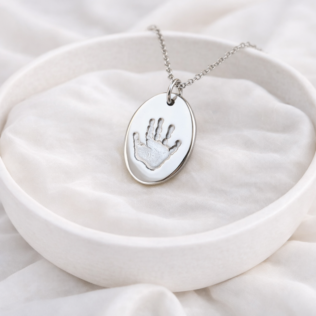 child handprint on a oval pendant