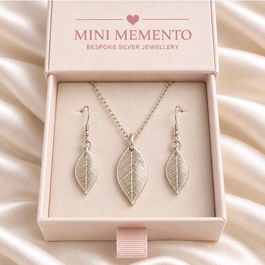 Silver jewellery set of real leaf imprint on a pendant and earrings