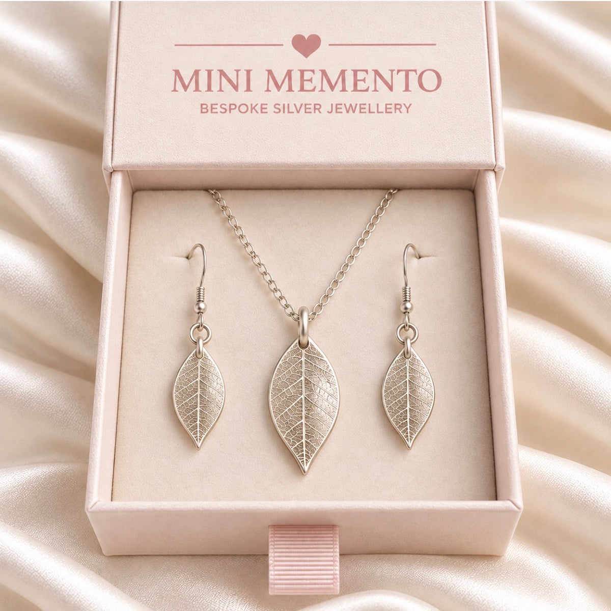 Silver jewellery set of real leaf imprint on a pendant and earrings