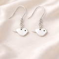 Hidden cremation ashes in silver bird earrings