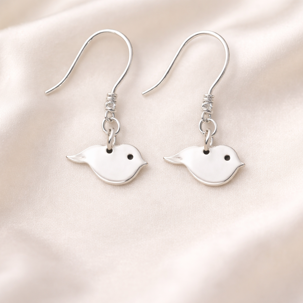 Hidden cremation ashes in silver bird earrings