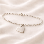 fingerprint on a small silver heart