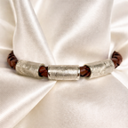 3 fingerprint charms on a leather bracelet